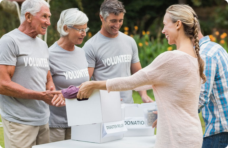 volunteer giving a box to the elderly